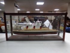 A model of the RMS Queen Mary in glazed display case,