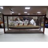 A model of the RMS Queen Mary in glazed display case,