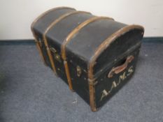 A wooden bound dome top trunk