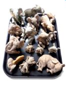 A tray containing a quantity of Tuskers and other elephant figures