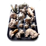 A tray containing a quantity of Tuskers and other elephant figures