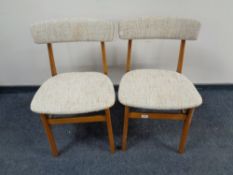 A pair of 20th century teak dining chairs