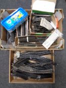 Two boxes containing a quantity of model railway track,