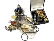 A quantity of earrings, brooches,