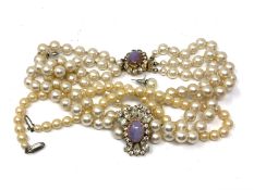 A quantity of costume pearl necklaces,