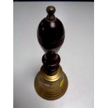 A brass hand bell marked Captain's Table