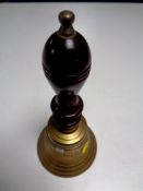 A brass hand bell marked Captain's Table