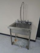 A stainless steel commercial sink