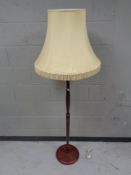 A standard lamp and shade