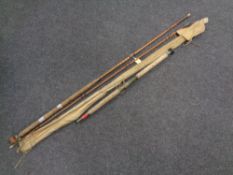 A vintage two piece fishing rod together with a further three piece rod in bag