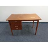 A mid 20th century Danish teak desk fitted four drawers