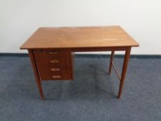 A mid 20th century Danish teak desk fitted four drawers