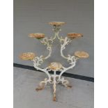A painted cast iron plant stand