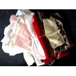A box containing duvet sets and pillow cases, three pairs of curtains, table cloth, napkins,