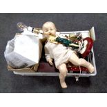 A box containing table lamp bases, vintage doll,