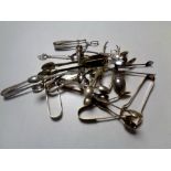 A collection of silver plated sugar tongs,