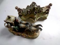 A continental porcelain bowl surmounted with cherubs together with a similar porcelain group