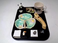 A tray containing Guinness Toucan pin, silver fob, USSR figure of a panda,