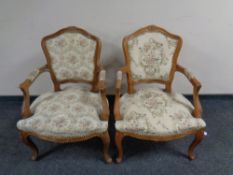 A pair of French beech framed salon chairs in studded tapestry fabric