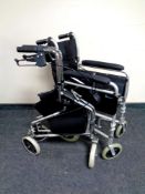 A folding Better Life wheelchair together with a walking aid