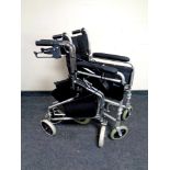 A folding Better Life wheelchair together with a walking aid