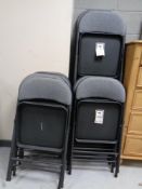 Approximately 16 contemporary folding chairs in grey upholstery