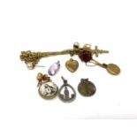 A small quantity of costume pendants, heart locket, crucifix,