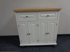 A contemporary side cabinet with pine effect top,