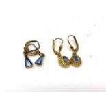Two pairs of yellow metal earrings