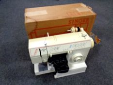 A Singer Melodie 40 sewing machine with foot pedal