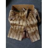 A mink fur coat by Marcus together with a further coat with fur collar