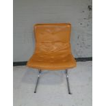 A continental buttoned tan leather chair on chrome support