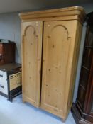 A pine double door wardrobe