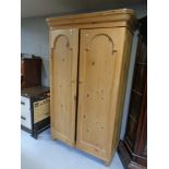 A pine double door wardrobe