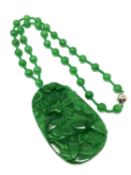 A large good quality jade pendant and necklace