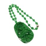 A large good quality jade pendant and necklace