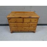 A contemporary pine four drawer low chest