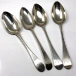Four Newcastle silver serving spoons, all Georgian, a pair by Dorothy Langlands,