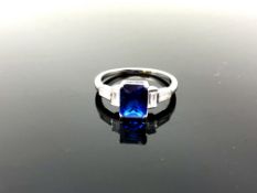 A sterling silver Art Deco style ring set with a blue stone,