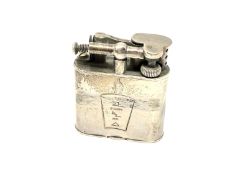 A silver lighter by Dunhill,