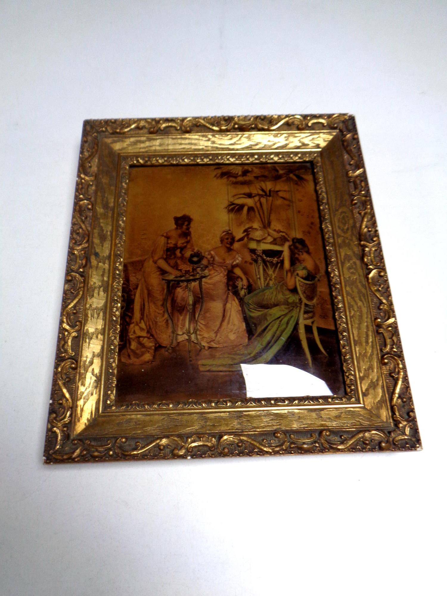 A gilt framed crystoleum depicting ladies in a drawing room