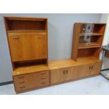 A 20th century teak modular sideboard fitted cupboards and drawers