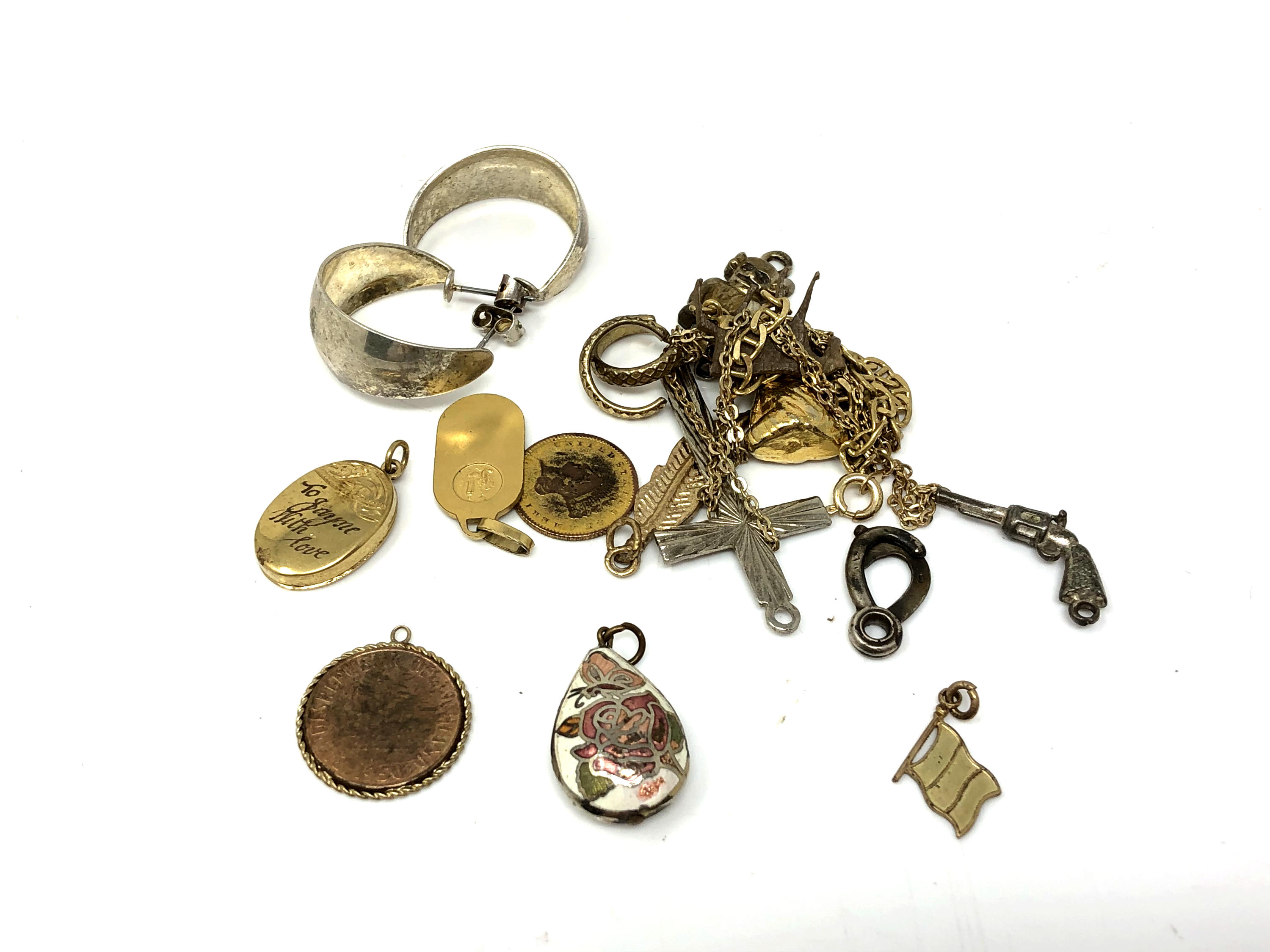 A small quantity of costume jewellery, pendants, miniature pistol charm,