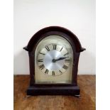 An Edwardian bracket clock with silver dial (electric)