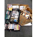 Approximately seven boxes and a bag containing a large quantity of CDs and DVDs