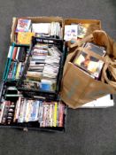 Approximately seven boxes and a bag containing a large quantity of CDs and DVDs