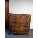 A regency inlaid mahogany bow fronted five drawer chest