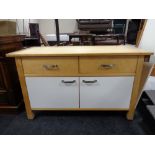 A contemporary kitchen sideboard fitted drawers and cupboards beneath