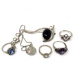A silver brooch together with dress rings,