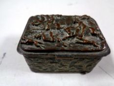 An antique plated embossed snuff box depicting a hunting scene (as found)